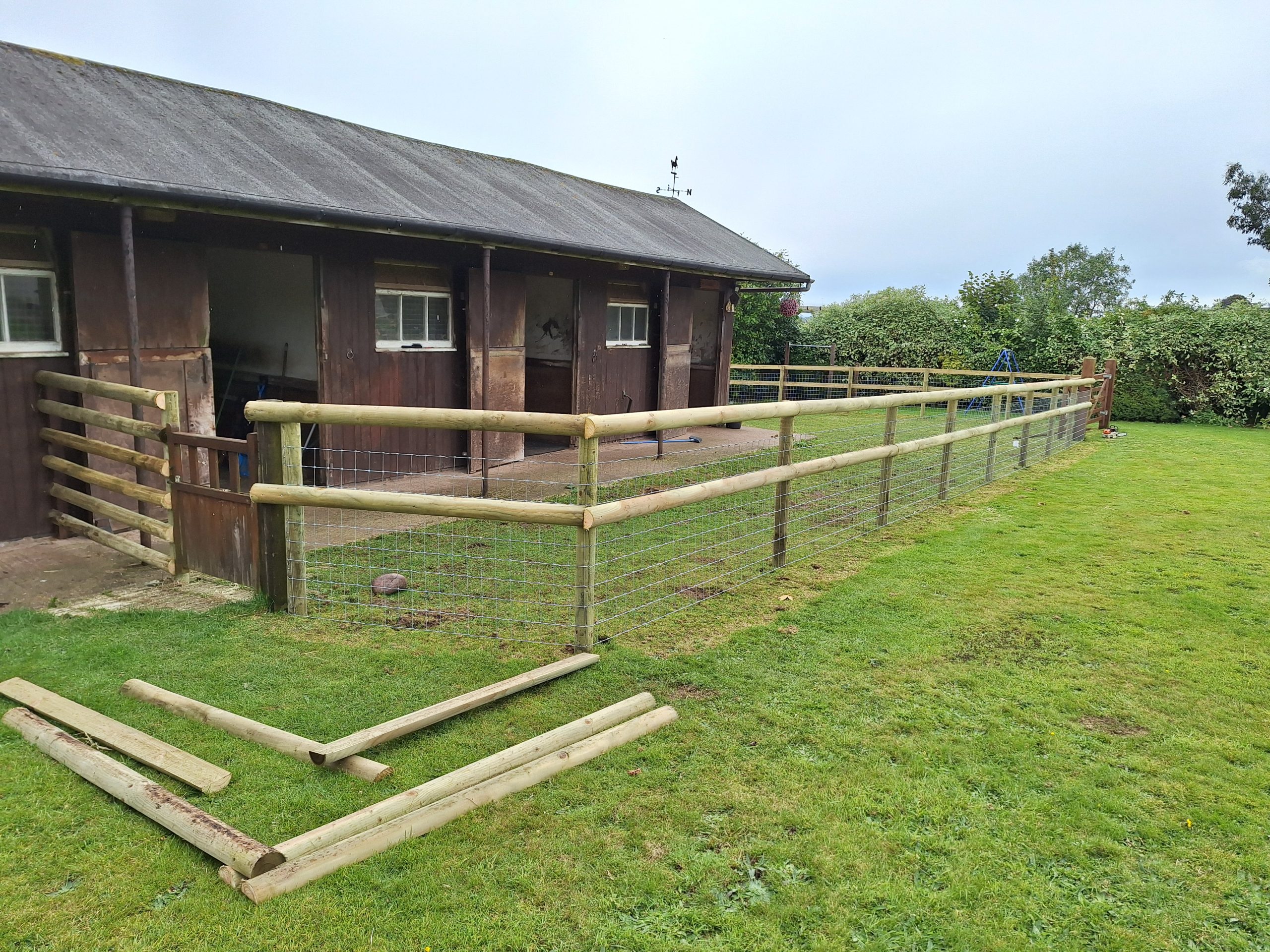 Post and rail fencing at stables, equestrian fencing Worcestershire