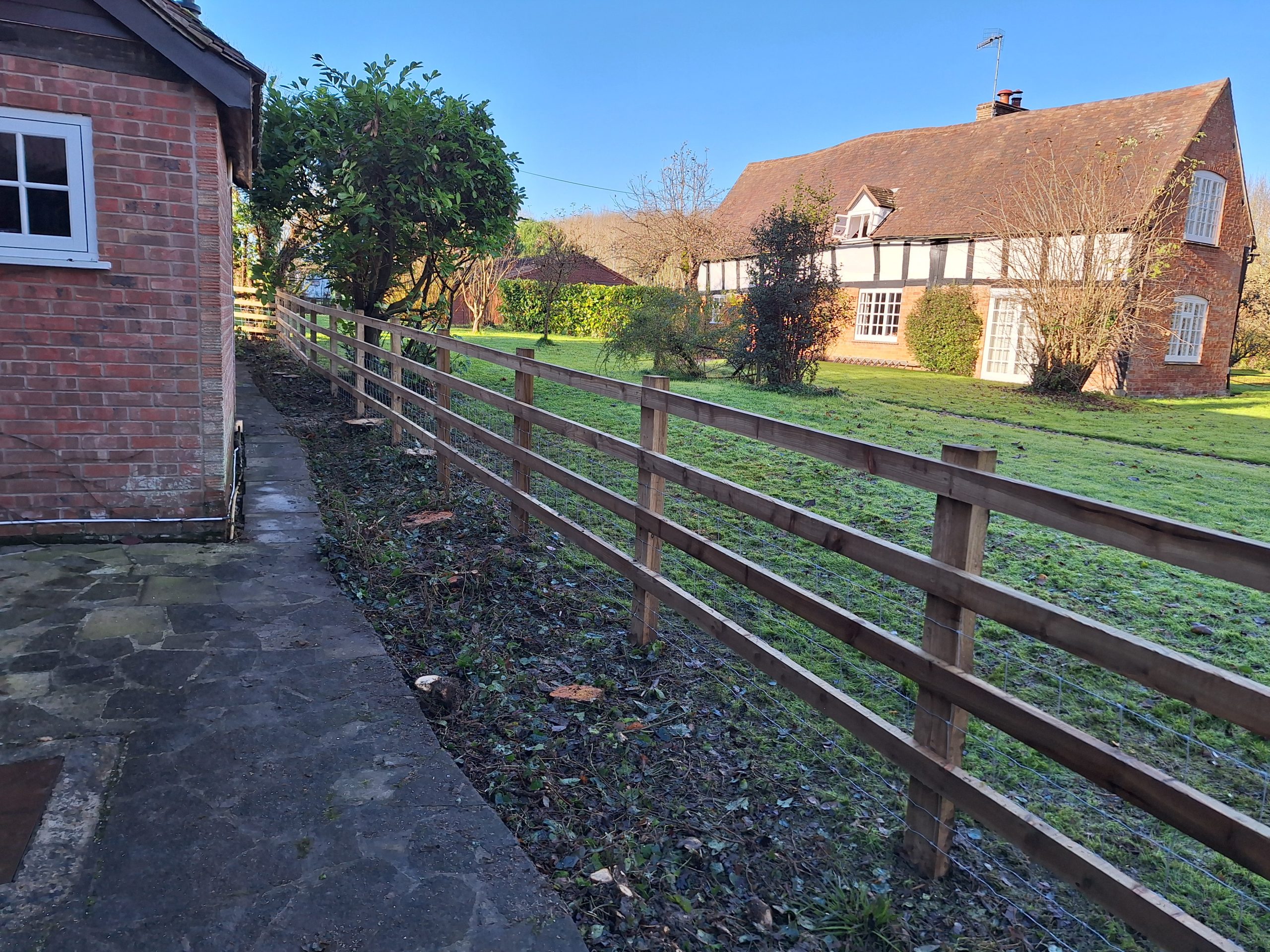 Post and rail fence garden
