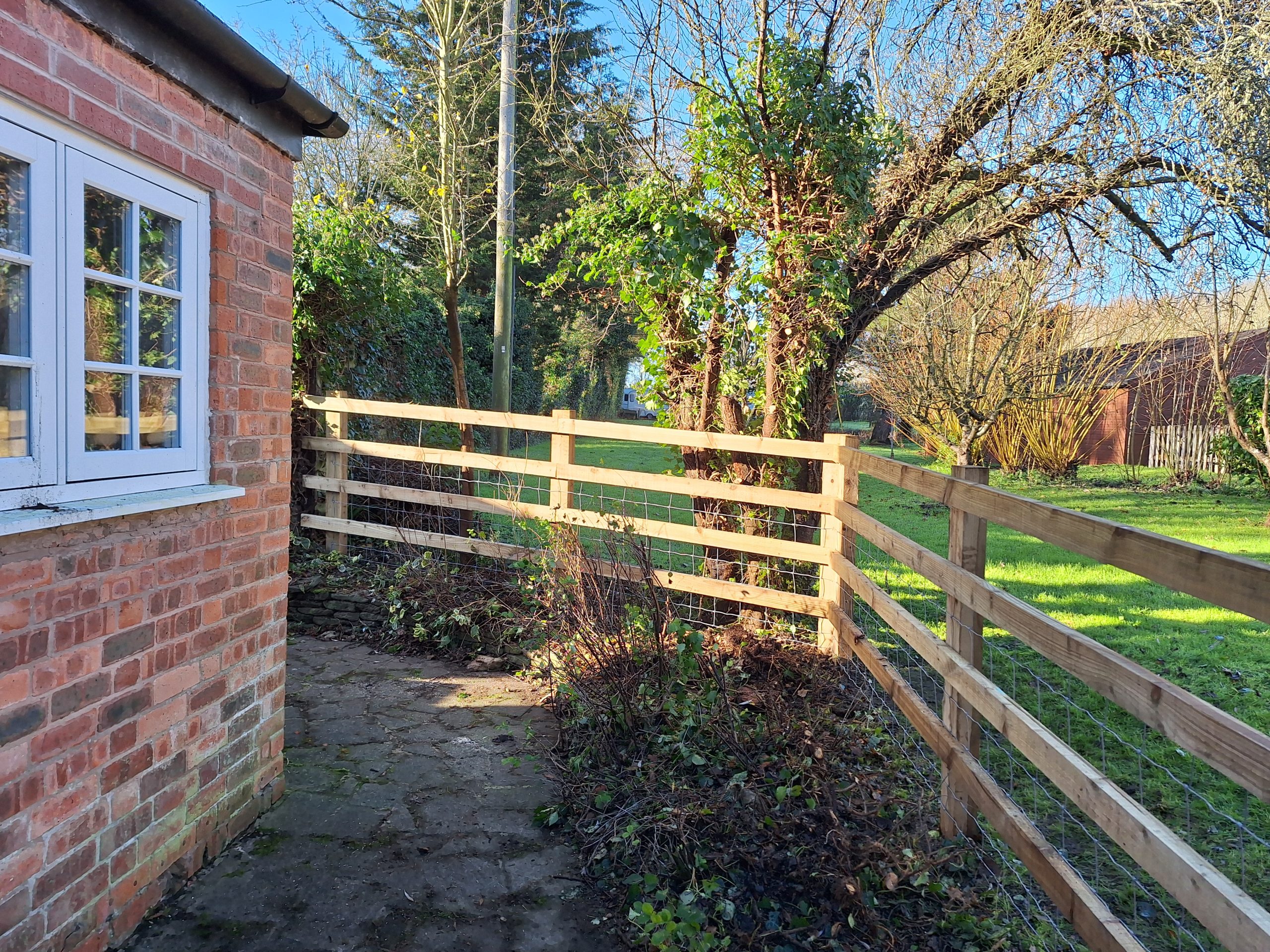 Post and rail fence brick property