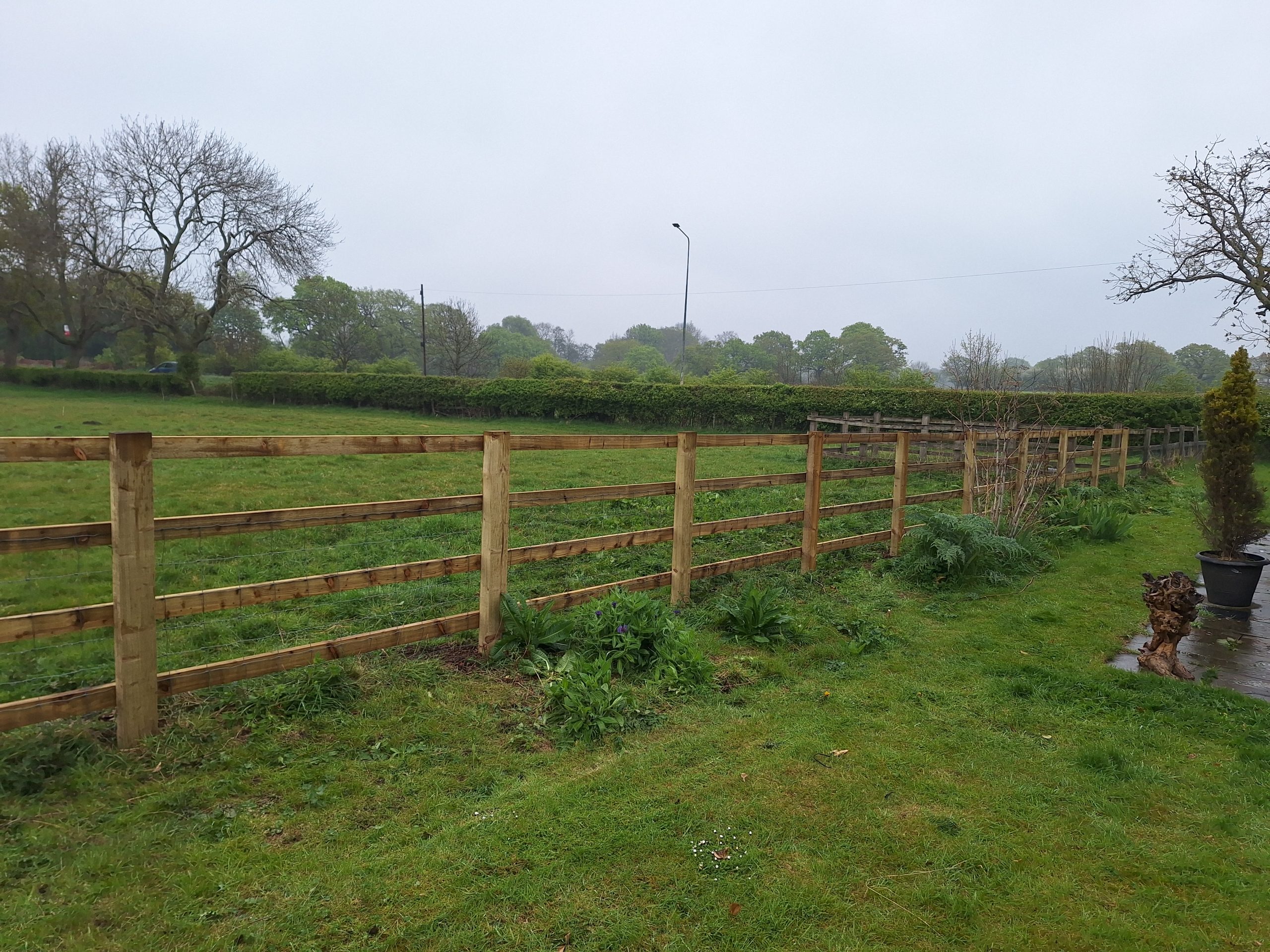 Post and rail fence across open field, Worcestershire