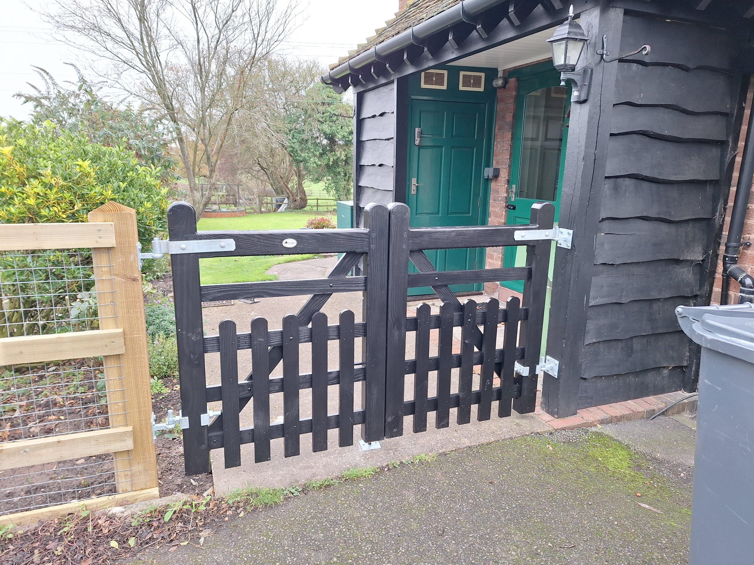 Timber picket fence with gate