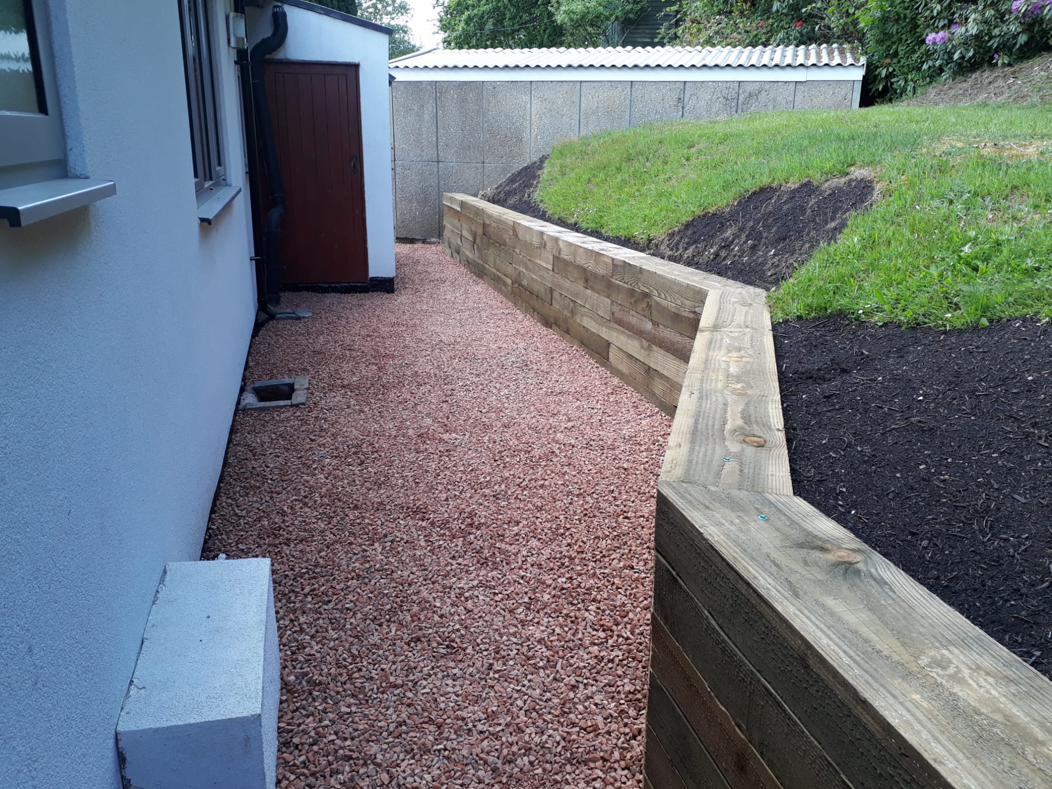 Garden walkway with timber retaining wall